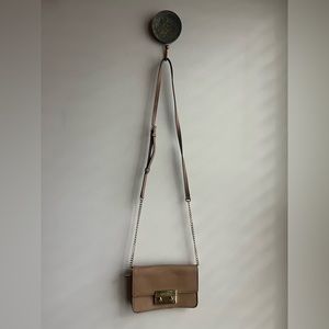 Michael Kors tan crossbody with gold accents.